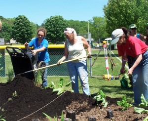 Rutgers Associate, Amy Boyijian and Master Gardener volunteers Barbara Darbin and Barbara Bravo installing the rain garden.