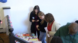 Volunteers perusing local agency literature table
